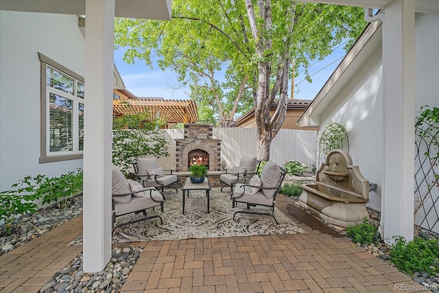 2340 S Columbine St, Denver, CO 80210 - view of patio / terrace featuring an outdoor living space with a fireplace