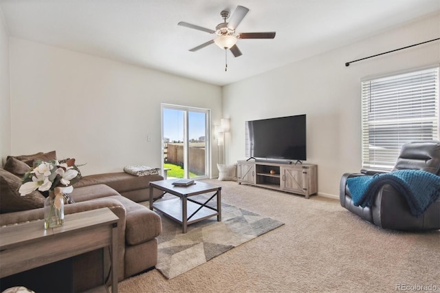 living room featuring ceiling fan and carpet