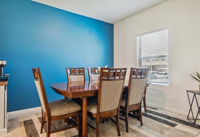 dining area with light carpet