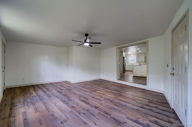 1815 S Monroe St, Denver, CO 80210 - unfurnished room with wood finished floors and a ceiling fan