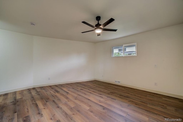1815 S Monroe St, Denver, CO 80210 - spare room with wood finished floors, ceiling fan, and a smoke detector