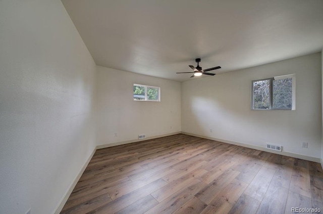 1815 S Monroe St, Denver, CO 80210 - unfurnished room featuring hardwood / wood-style floors and a ceiling fan