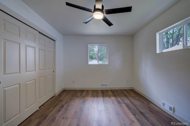 1815 S Monroe St, Denver, CO 80210 - unfurnished bedroom with wood finished floors, a ceiling fan, and a closet