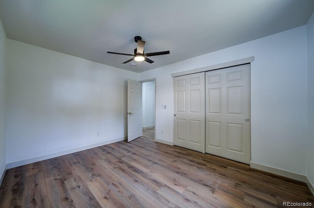 1815 S Monroe St, Denver, CO 80210 - unfurnished bedroom featuring wood finished floors, a closet, and a ceiling fan