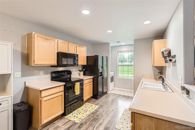 10700 Kimblewyck Cir Unit 155, Northglenn, CO 80233 - kitchen with black appliances, light brown cabinets, light wood finished floors, light countertops, and recessed lighting