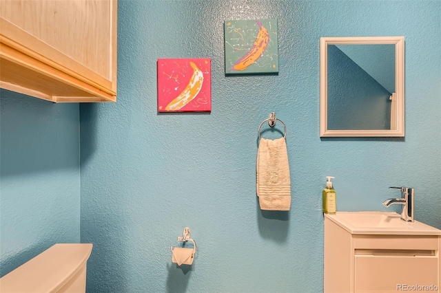 10700 Kimblewyck Cir Unit 155, Northglenn, CO 80233 - bathroom featuring toilet and vanity