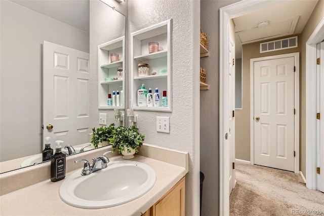 10700 Kimblewyck Cir Unit 155, Northglenn, CO 80233 - bathroom featuring vanity and a textured wall
