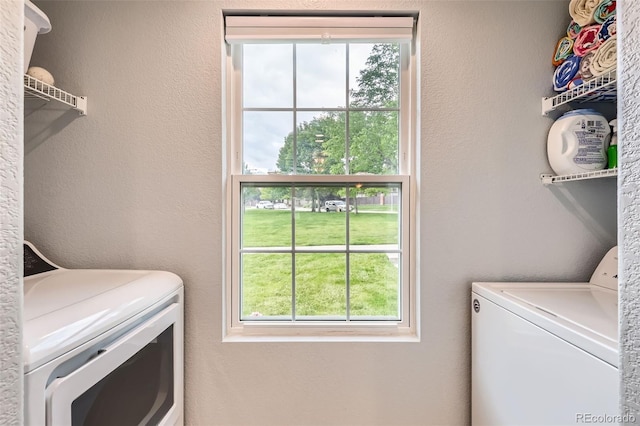 10700 Kimblewyck Cir Unit 155, Northglenn, CO 80233 - laundry room featuring washer and clothes dryer and healthy amount of natural light