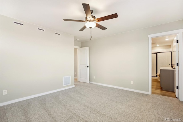 9456 Yampa Ct, Commerce City, CO 80022 - unfurnished bedroom with light carpet, baseboards, and visible vents
