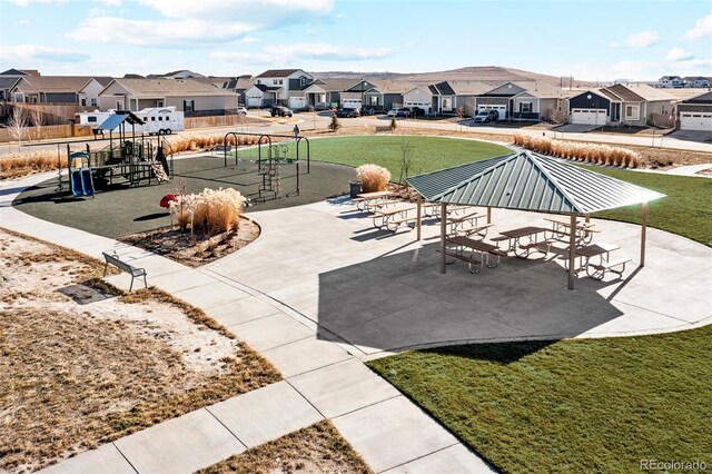 9456 Yampa Ct, Commerce City, CO 80022 - view of patio / terrace featuring playground community and a residential view