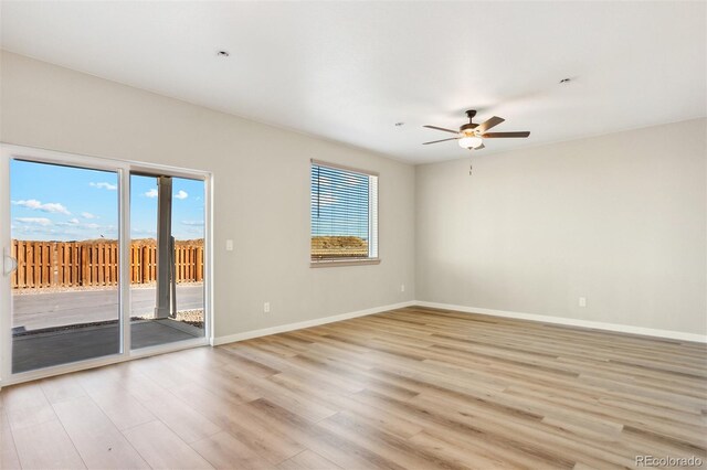 9456 Yampa Ct, Commerce City, CO 80022 - unfurnished room with plenty of natural light, light wood-style floors, baseboards, and ceiling fan