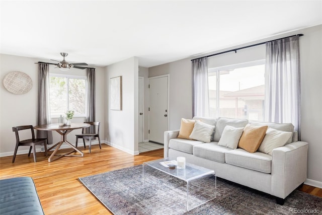 living room featuring baseboards and wood finished floors