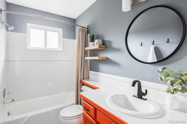 bathroom with toilet, vanity, and shower / tub combo with curtain