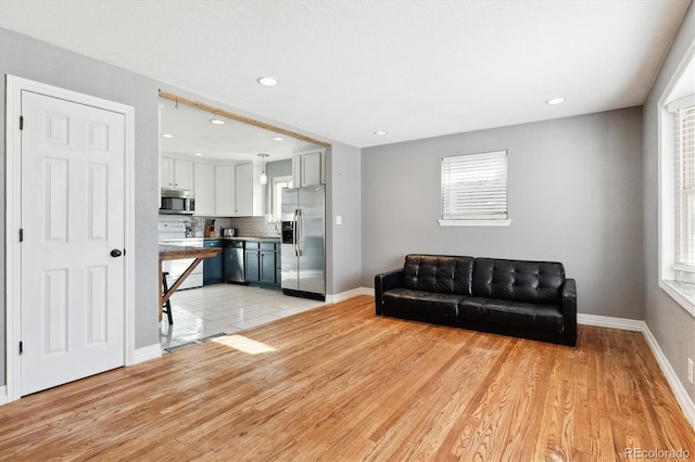 living room with light hardwood / wood-style floors