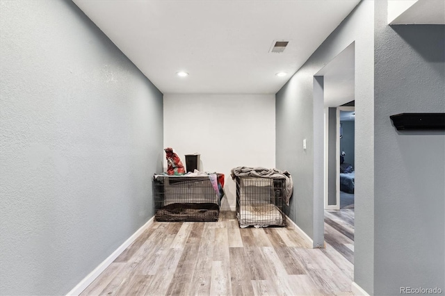 hallway featuring light hardwood / wood-style flooring