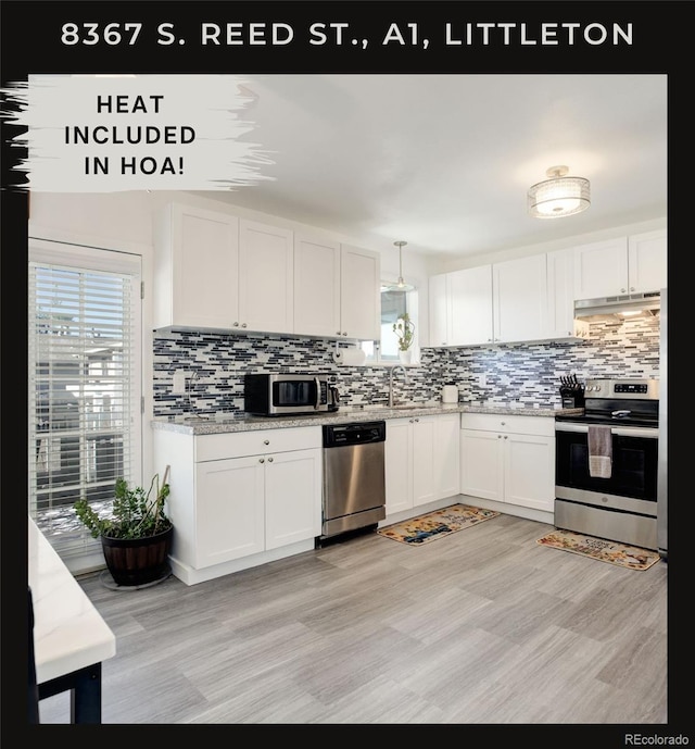 kitchen with white cabinetry, pendant lighting, a healthy amount of sunlight, and appliances with stainless steel finishes