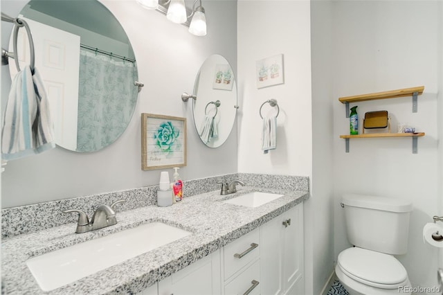 bathroom featuring vanity and toilet