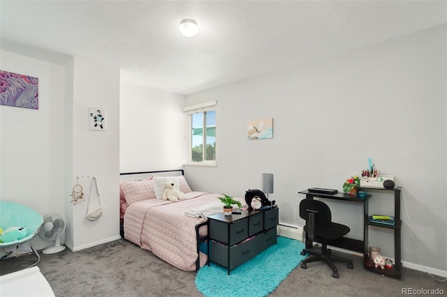 bedroom featuring a baseboard heating unit and carpet