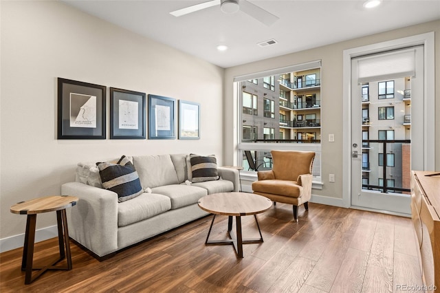 living area featuring visible vents, wood finished floors, baseboards, recessed lighting, and a ceiling fan