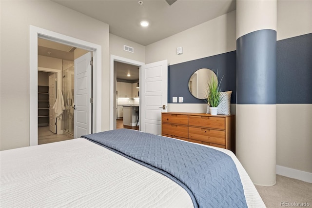 carpeted bedroom featuring visible vents and baseboards