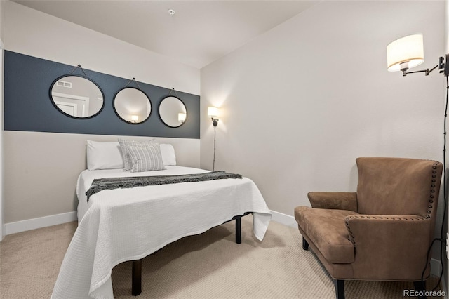 carpeted bedroom featuring baseboards