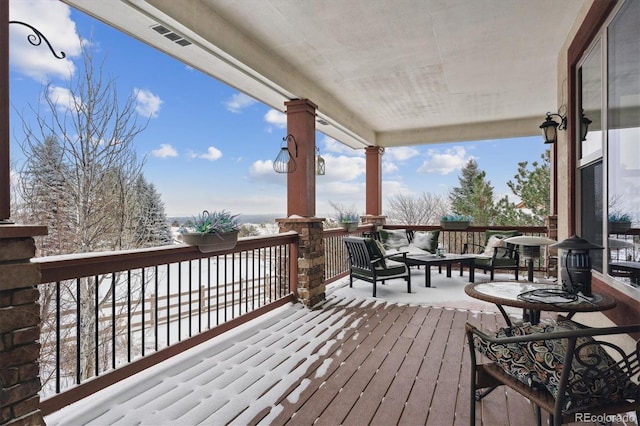 view of snow covered deck