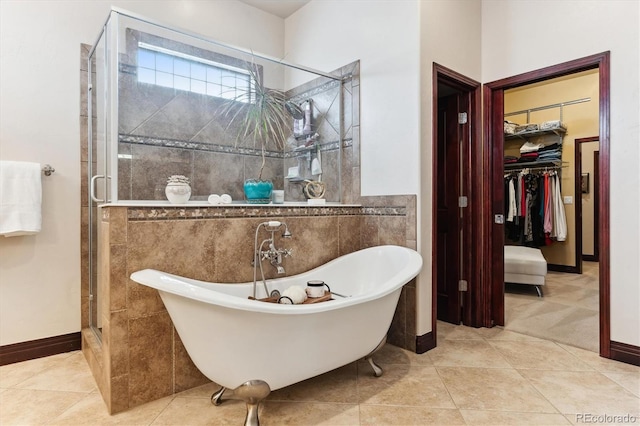 bathroom with independent shower and bath and tile patterned flooring