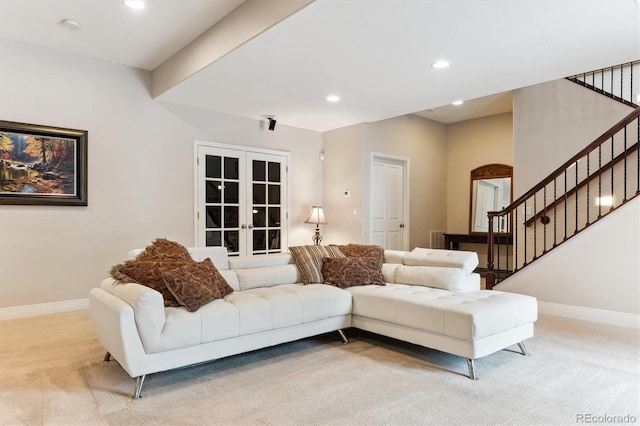 living room featuring french doors and light carpet