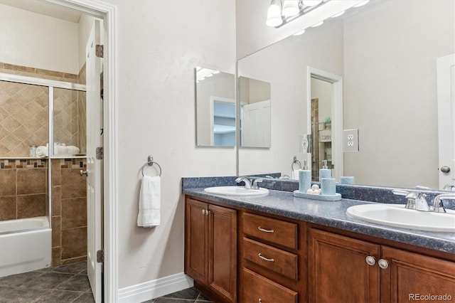 bathroom featuring vanity, tile patterned floors, and tiled shower / bath