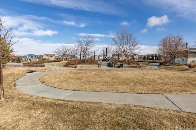 surrounding community featuring a yard and a residential view