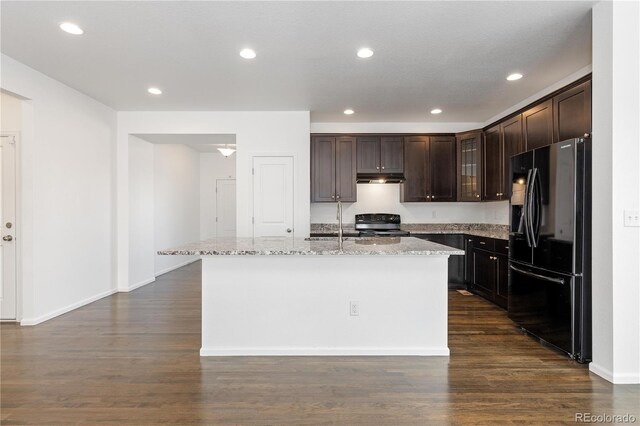 kitchen with black appliances, dark brown cabinets, dark wood-style flooring, and glass insert cabinets