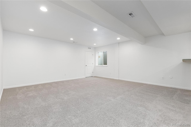 spare room featuring baseboards, visible vents, and recessed lighting