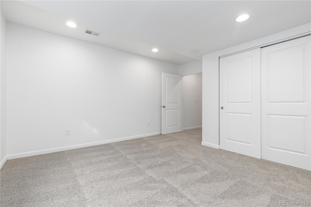 unfurnished bedroom featuring recessed lighting, a closet, visible vents, carpet flooring, and baseboards