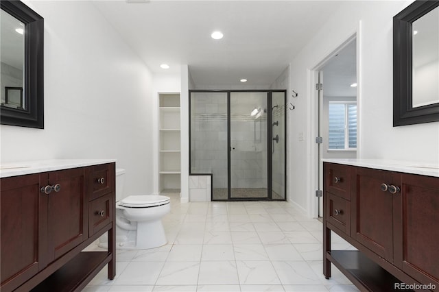 bathroom featuring marble finish floor, a shower stall, vanity, and recessed lighting