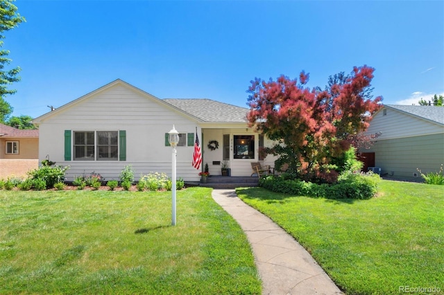 2309 Magellan St, Colorado Springs, CO 80907 - view of front of house with a front lawn and a porch