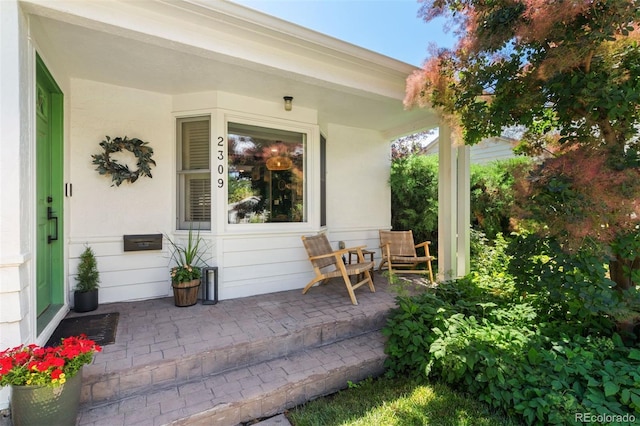 2309 Magellan St, Colorado Springs, CO 80907 - entrance to property featuring covered porch and stucco siding