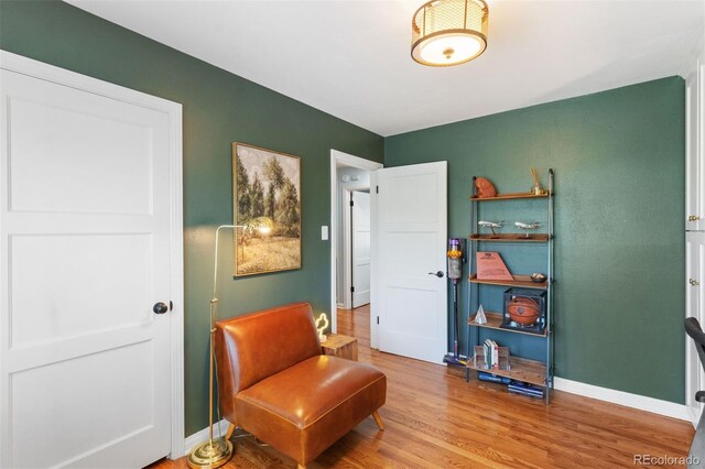 2309 Magellan St, Colorado Springs, CO 80907 - sitting room featuring wood finished floors and baseboards