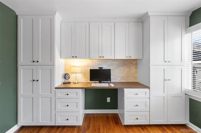 2309 Magellan St, Colorado Springs, CO 80907 - unfurnished office featuring built in desk and wood finished floors