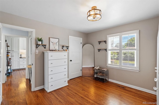 2309 Magellan St, Colorado Springs, CO 80907 - bedroom featuring wood finished floors and arched walkways