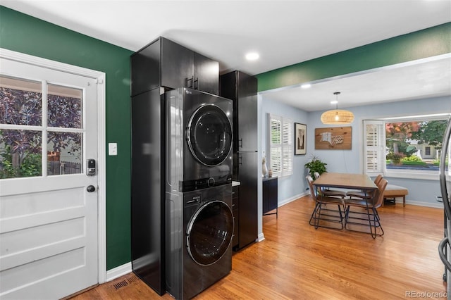 2309 Magellan St, Colorado Springs, CO 80907 - laundry room with stacked washer / dryer, light wood-type flooring, plenty of natural light, and recessed lighting