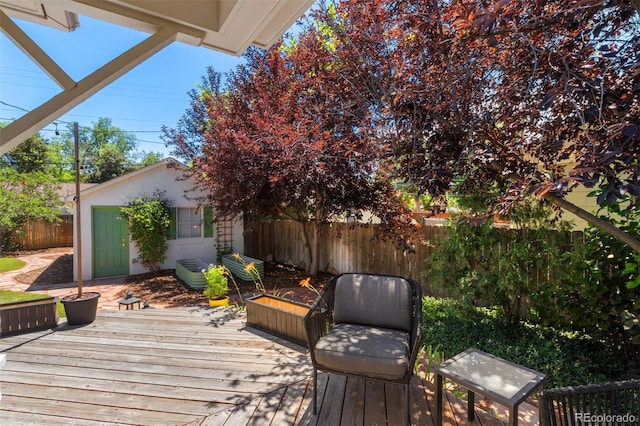 2309 Magellan St, Colorado Springs, CO 80907 - wooden terrace featuring a fenced backyard and an outdoor structure