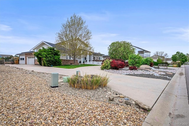 view of yard with driveway and an attached garage