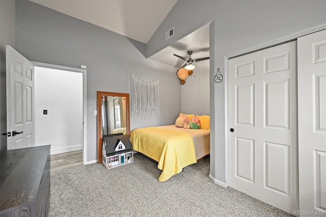 bedroom with vaulted ceiling, carpet, baseboards, and a ceiling fan