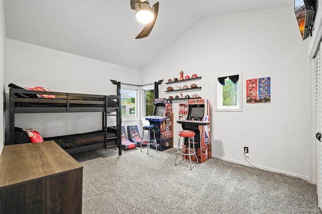 bedroom featuring carpet, vaulted ceiling, baseboards, and ceiling fan