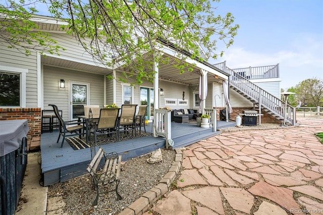 view of patio with a wooden deck, a grill, an outdoor hangout area, and outdoor dining area
