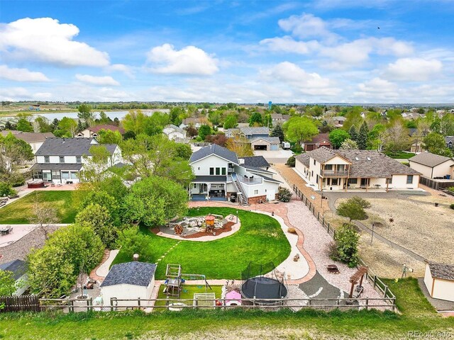 aerial view of residential area with a nearby body of water