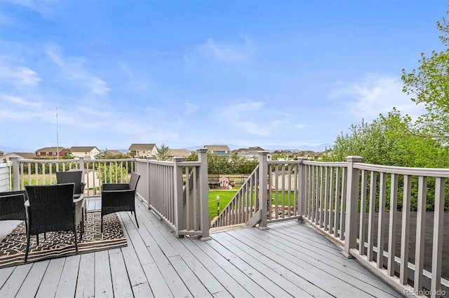 wooden terrace featuring a residential view