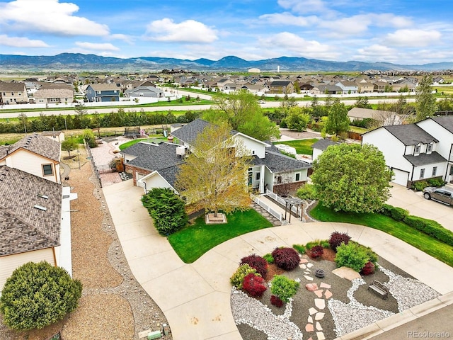 aerial view of residential area with a mountainous background