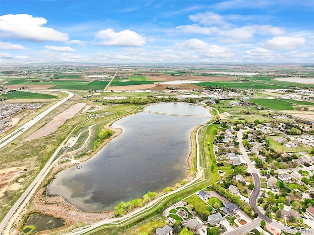 aerial perspective of suburban area featuring a nearby body of water