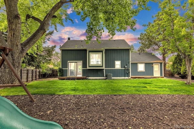1304 Ceres Dr, Lafayette, CO 80026 - back of property featuring central air condition unit, board and batten siding, and roof with shingles